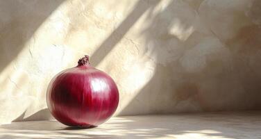 Red onion resting on a surface with gentle light illuminating its texture and shape photo