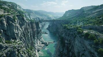 Majestic Canyon Landscape with River and Bridge Under Clear Sky photo