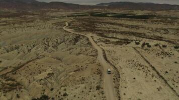 Aerial view of a vehicle crossing the Abanilla desert or Mahoya desert in Murcia video