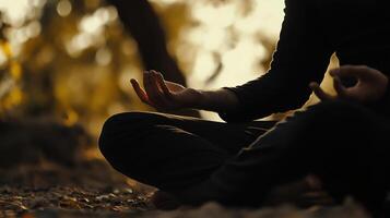 Practicing meditation in a serene outdoor setting during golden hour photo
