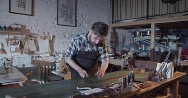 Craftsman cutting piece from leather strip video