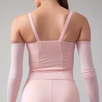 woman in pink bodysuit with open back photo