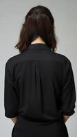 Back view of a woman in a black suit jacket photo