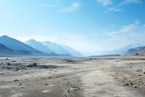 Vast desert landscape with mountains in the distance photo