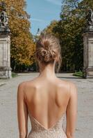 Woman in backless dress with elegant updo, back view photo