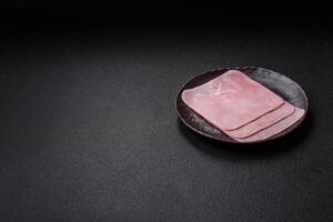 Ham cut into square slices for making delicious nutritious sandwiches photo