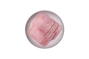 Ham cut into square slices for making delicious nutritious sandwiches photo