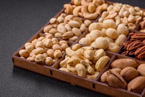 Box with various nuts cashew, macadamia, peanut, cedar, pecan, walnut, brazil, hazelnut photo