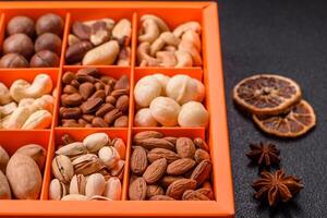Box with various nuts cashew, macadamia, peanut, cedar, pecan, walnut, brazil, hazelnut photo