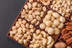 Box with various nuts cashew, macadamia, peanut, cedar, pecan, walnut, brazil, hazelnut photo