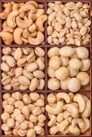 Box with various nuts cashew, macadamia, peanut, cedar, pecan, walnut, brazil, hazelnut photo