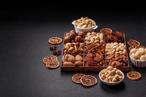 Box with various nuts cashew, macadamia, peanut, cedar, pecan, walnut, brazil, hazelnut photo