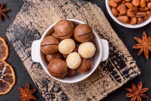 Delicious nutritious macadamia nuts in ceramic bowl photo