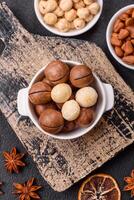 Delicious nutritious macadamia nuts in ceramic bowl photo