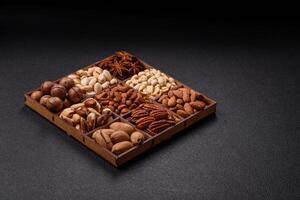 Box with various nuts cashew, macadamia, peanut, cedar, pecan, walnut, brazil, hazelnut photo