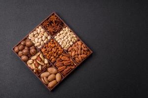 Box with various nuts cashew, macadamia, peanut, cedar, pecan, walnut, brazil, hazelnut photo