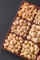 Box with various nuts cashew, macadamia, peanut, cedar, pecan, walnut, brazil, hazelnut photo