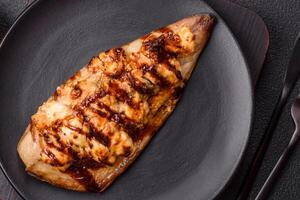 Grilled mackerel fillets with cheese, salt, spices and herbs photo