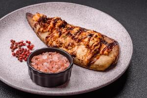 Grilled mackerel fillets with cheese, salt, spices and herbs photo