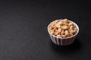 Delicious nutritious peanut in ceramic bowl photo
