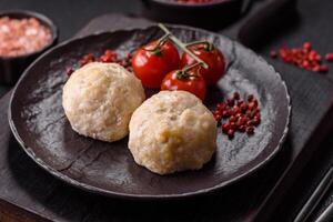 Delicious healthy steamed chicken cutlets or minced meatballs photo