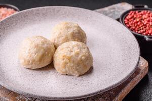 Delicious healthy steamed chicken cutlets or minced meatballs photo
