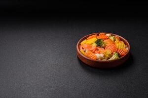 Delicious fresh vegetables steamed carrots, broccoli, cauliflower photo