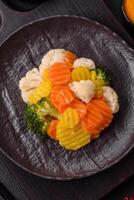Delicious fresh vegetables steamed carrots, broccoli, cauliflower photo