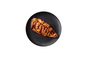 Grilled mackerel fillets with cheese, salt, spices and herbs photo