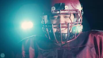 American football player in team uniform, pads, and helmet, confidently pointing at the camera. A powerful, action-packed image capturing team spirit and readiness for the game video