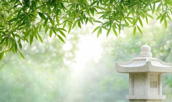 A stone lantern sitting in front of a bamboo tree photo
