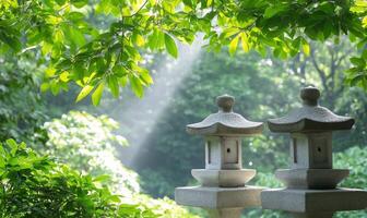 Two stone lanterns in the middle of a green garden photo