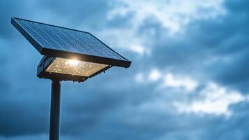 Solar-powered streetlight illuminating a cloudy evening sky. photo
