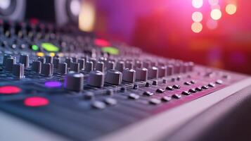 Close-up of a professional audio mixing console with colorful controls. photo