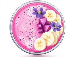 Vibrant smoothie bowl with pink hues, topped with banana slices and decorative flowers, served in a clear bowl on a clean white background photo