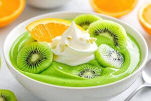 Bright smoothie bowl topped with kiwi, orange slices, and creamy yogurt in a sunny setting photo