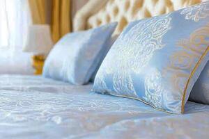 Luxurious bedroom featuring elegant silk bedding and plush pillows in a serene environment with bright natural light photo