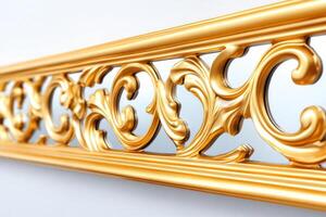 Gilded mirror with intricate designs reflecting natural light against a soft white wall in a bright and airy setting photo
