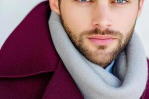 Sophisticated mens fashion features a handsome model showcasing a chic coat and scarf, set against a clean, neutral backdrop in a stylish urban environment during autumn photo
