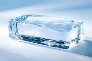 Smooth ice block with frosty textures illuminated by soft blue and white tones creating a cool aesthetic photo