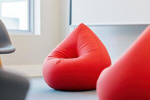 Dynamic meeting space with red bean bags and motivational posters designed for effective brainstorming sessions photo