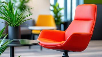 Stylish coworking space featuring red ergonomic chairs and glass tables surrounded by greenery and soft industrial lighting photo
