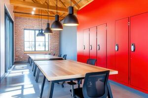 Creative workspace featuring modern design with red lockers and spacious tables for team collaboration and brainstorming activities photo