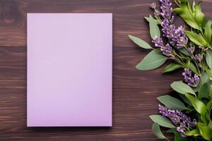 Elegant wedding invitation flat lay showcasing pastel tones with floral accents against a dark wooden backdrop photo