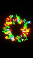 A colorful light display is shown on a black background video