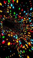 A colorful light show is shown in a black background video