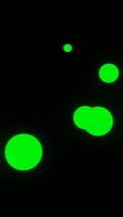 Glowing green circles on a black background video