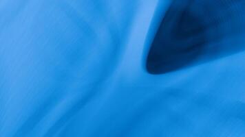 A blue abstract background with a wave pattern video
