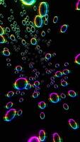A bunch of colorful bubbles floating in the air video