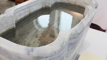 Singapore 05 may 2024. Font for Christian baptism of an infant. Baptismal font video